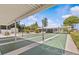 Well-maintained shuffleboard courts providing recreational fun with inviting landscaping and shaded seating areas at 12400 Park Blvd # 210, Seminole, FL 33772
