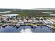 Aerial view of a waterfront home in a canal community with boat docks at 12700 5Th Isle, Hudson, FL 34667
