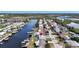 Scenic aerial view of waterfront homes in a community with canals and boat docks at 12700 5Th Isle, Hudson, FL 34667