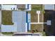 Aerial view of backyard with patio, dock and waterfront access on a sunny day at 12700 5Th Isle, Hudson, FL 34667