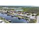Aerial view of a waterfront home in a canal community at 12700 5Th Isle, Hudson, FL 34667