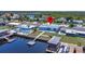 Waterfront home with a private dock, boat lift, and pool overlooking a tranquil canal at 12700 5Th Isle, Hudson, FL 34667