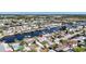 Scenic aerial view of a waterfront community with canals and beautiful homes, location marked by a red pin at 12700 5Th Isle, Hudson, FL 34667