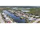 Aerial view of a waterfront home in a canal community at 12700 5Th Isle, Hudson, FL 34667