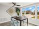 Bright dining area with a modern table, stylish chairs, and a large window with a view at 12700 5Th Isle, Hudson, FL 34667