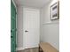 Inviting hallway featuring neutral tones, decorative wainscoting, and stylish decor at 12700 5Th Isle, Hudson, FL 34667