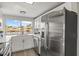 A bright kitchen with stainless steel appliances and a view of the canal at 12700 5Th Isle, Hudson, FL 34667