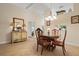 Dining room with a stylish chandelier and elegant decor at 1300 Shady Pine Way # B, Tarpon Springs, FL 34688