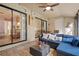Relaxing sunroom with comfortable seating, decorative tile flooring, and plenty of natural light at 1300 Shady Pine Way # B, Tarpon Springs, FL 34688
