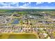 Sprawling aerial view showcases a residential community nestled among lakes and verdant landscapes, offering a serene setting at 13411 Graham Yarden Dr, Riverview, FL 33579