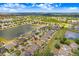 Stunning aerial view of a residential area featuring picturesque lakes and lush greenery, showcasing a peaceful community at 13411 Graham Yarden Dr, Riverview, FL 33579