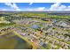 Expansive aerial view captures a residential area with lakes and green spaces, offering a glimpse into a peaceful lifestyle at 13411 Graham Yarden Dr, Riverview, FL 33579