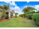 Well-maintained backyard with lush landscaping and privacy fence at 13411 Graham Yarden Dr, Riverview, FL 33579