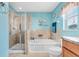 Large bathroom with tile floors, shower, soaking tub, and bright walls at 13411 Graham Yarden Dr, Riverview, FL 33579