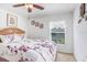 Bright bedroom with a ceiling fan, comfortable bed, and a peaceful ambiance for restful nights at 13411 Graham Yarden Dr, Riverview, FL 33579