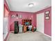 Bright bedroom featuring neutral carpet, a closet and walls painted in a distinctive mauve shade at 13411 Graham Yarden Dr, Riverview, FL 33579