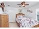 Cozy bedroom with a ceiling fan, comfortable bed, and serene decor for a relaxing retreat at 13411 Graham Yarden Dr, Riverview, FL 33579