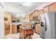 Well-lit kitchen featuring stainless steel appliances, granite countertops, and a mobile island at 13411 Graham Yarden Dr, Riverview, FL 33579