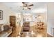 Spacious living area with hardwood floors, connecting dining area, and comfortable seating arrangement at 13411 Graham Yarden Dr, Riverview, FL 33579