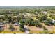 Aerial shot of a neighborhood featuring large lots, mature trees, and well-spaced homes at 1350 Mustang St, Nokomis, FL 34275