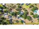 Aerial view of property showcasing pool, landscaping, and the surrounding neighborhood at 1350 Mustang St, Nokomis, FL 34275