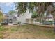 Backyard with screened pool area, patio, and a covered carport for boat or RV parking at 1350 Mustang St, Nokomis, FL 34275
