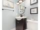 This bathroom features a modern sink and vanity combo, complemented by tasteful decor and lighting at 1350 Mustang St, Nokomis, FL 34275