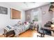 This charming bedroom features a cozy single bed and a workspace, perfect for study or creative projects at 1350 Mustang St, Nokomis, FL 34275