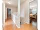Hallway with wood floors, and a view into the bedroom at 1350 Mustang St, Nokomis, FL 34275