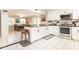 Open concept kitchen with stainless steel appliances, and dining room with seating at 1350 Mustang St, Nokomis, FL 34275