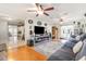 Comfortable living room with hardwood floors, large sofas, and a modern entertainment center at 1350 Mustang St, Nokomis, FL 34275