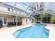 Inviting screened-in pool and patio area with outdoor dining space perfect for entertaining at 1350 Mustang St, Nokomis, FL 34275