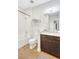 Bright bathroom featuring dark cabinets, shower, tub, and modern fixtures at 13518 Circa Crossing Dr, Lithia, FL 33547