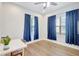 Bedroom with natural light, neutral paint, and hardwood floors at 13518 Circa Crossing Dr, Lithia, FL 33547