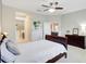 Spacious bedroom with ensuite bathroom, furniture, and hardwood floor at 13518 Circa Crossing Dr, Lithia, FL 33547