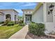 Inviting home featuring well-maintained landscaping and an open porch entryway at 13518 Circa Crossing Dr, Lithia, FL 33547