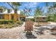 Community clubhouse shows walkway and community sign at 13518 Circa Crossing Dr, Lithia, FL 33547