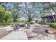 Outdoor common area with a firepit surrounded by chairs and covered porch at 13518 Circa Crossing Dr, Lithia, FL 33547