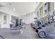 Community gym with weight machines, treadmills, large windows and tv at 13518 Circa Crossing Dr, Lithia, FL 33547