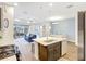 Kitchen area showing open concept to living and dining rooms with stainless appliances at 13518 Circa Crossing Dr, Lithia, FL 33547