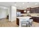Elegant kitchen featuring an island, stainless steel appliances, and ample cabinet space at 13518 Circa Crossing Dr, Lithia, FL 33547