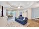 Living room with sliding glass doors to lanai and view of backyard at 13518 Circa Crossing Dr, Lithia, FL 33547