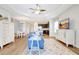 Open concept living room with view into kitchen and dining room and adjacent spaces at 13518 Circa Crossing Dr, Lithia, FL 33547