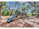 Community playground with multiple play structures and surrounding trees at 13518 Circa Crossing Dr, Lithia, FL 33547