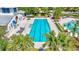 Beautiful lap pool with bright blue lines next to the clubhouse and relaxing lounge chairs at 13518 Circa Crossing Dr, Lithia, FL 33547