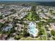 Aerial view showcasing a community pool and clubhouse surrounded by neatly landscaped residential areas at 14204 Barrington Stowers Dr, Lithia, FL 33547