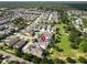 Ideal property location marked with a red pin, offering community pool, open spaces, tree-lined streets and park at 14204 Barrington Stowers Dr, Lithia, FL 33547