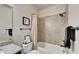 Well-lit bathroom featuring a shower-tub combination and granite vanity at 14204 Barrington Stowers Dr, Lithia, FL 33547