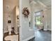 Charming powder room with unique wallpaper, decorative fixtures, and a decorative wreath at 14204 Barrington Stowers Dr, Lithia, FL 33547