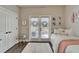 Bright bedroom with French doors, a comfortable bed and natural light at 14204 Barrington Stowers Dr, Lithia, FL 33547